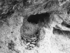 Typical nest site of the Rock Wren in western Kansas showing entrance into cliff cavity and nest pavement at entrance. Photo by GHF. From Birds of North America